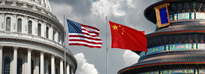 USA China flags outside government office in Washington and Beijing